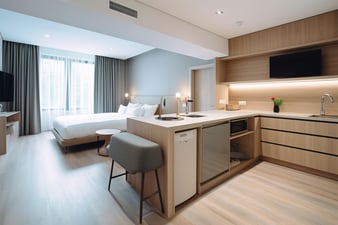 hotel-room-interior-with-bedroom-area-living-space-kitchen